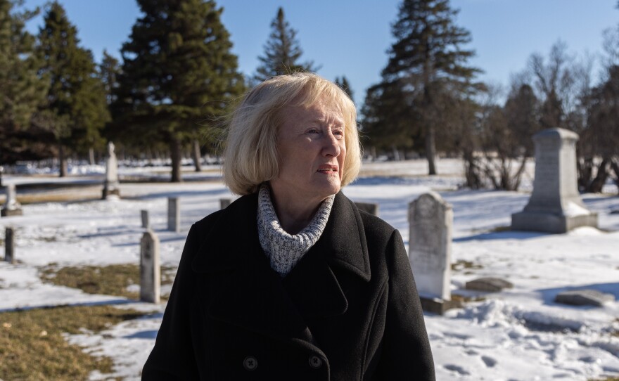 Darla Gebhard walks through the New Ulm City Cemetery, where many settlers who died in the U.S.-Dakota wars are buried.