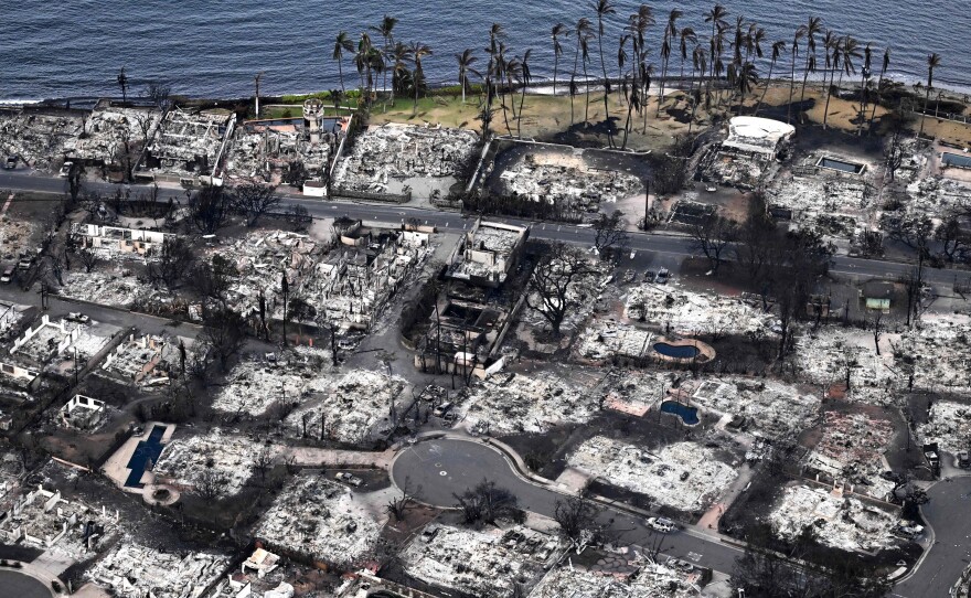 An aerial image taken on Aug. 10, 2023 shows destroyed homes and buildings burned to the ground in Lahaina in the aftermath of wildfires in western Maui, Hawaii. Rumors and conspiracy theories quickly flourished after the fire, hampering relief efforts.