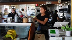 Waitress Daisy Marlene Montes Carranza works at El Rincon restaurant in the San Ysidro neighborhood of San Diego on April 16, 2024. Some economists say workers like Carranza may not get much benefit from the 'no tax on tips' change to the tax code. 
