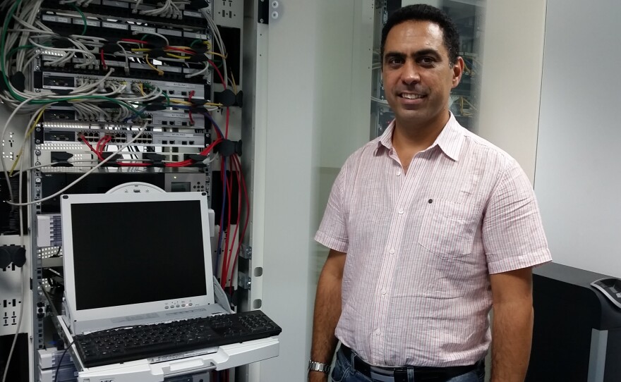 Ramzi El-Fekih, CEO of Creova, stands in his server room in Tunis. He's built a mobile payments company, but because of banking restrictions, Tunisians can only use his product for domestic purchases.