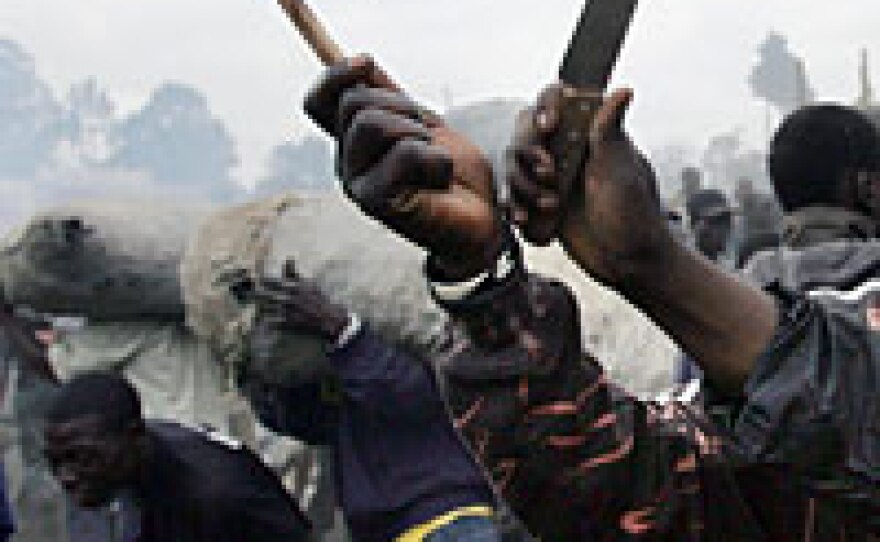 Supporters of defeated presidential candidate Raila Odinga wave a Kenyan flag during violent protests in Nairobi, Kenya, on Monday. Odinga's supporters say the election was rigged.