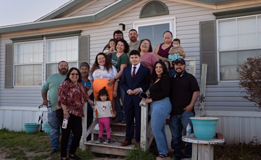 Caitlynn Almance (wearing orange) poses for a portrait with family members at her parents' home in Odessa, Texas. "The bond my siblings have with each other — it's just the most beautiful bond ever," says Caitlynn, who was six months pregnant in this photo taken in early March.