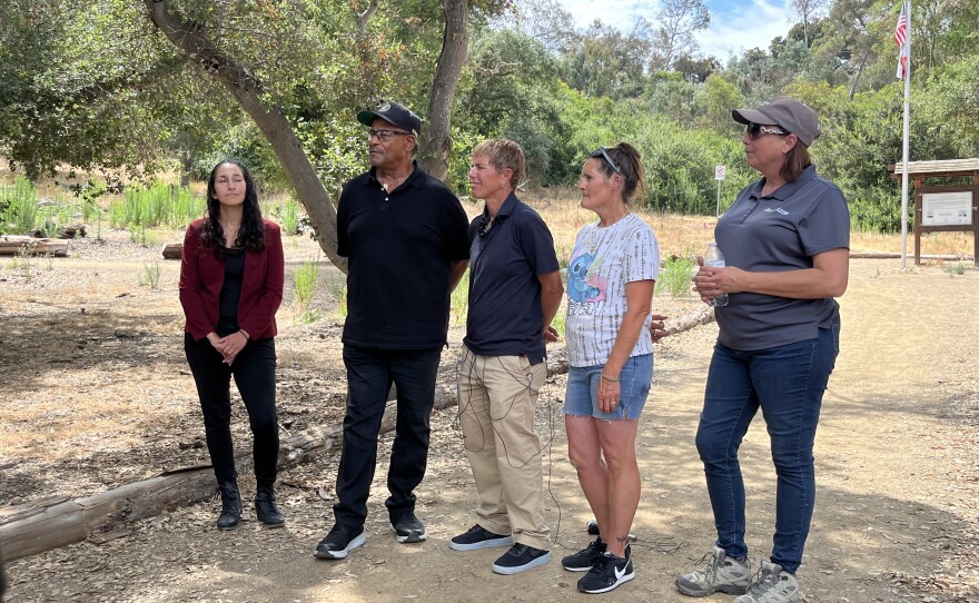Staff from Dreams For Change are shown along with a City of San Diego employee and two clients from the safe sleeping site, Keith Johnson and Tina Smith on August 8, 2023.