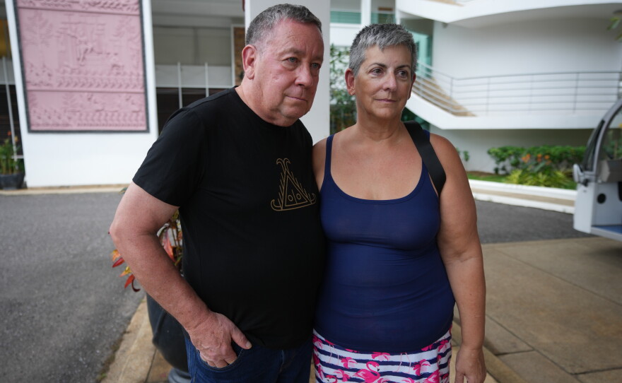 A couple passenger from a U.S. cruise ship, the MV Odyssey, Paul Montoya, left, stands for an interview with his wife, Lynn Motoya, at the Independence Hotel in Sihanoukville, Cambodia, Wednesday, Oct. 28, 2026.