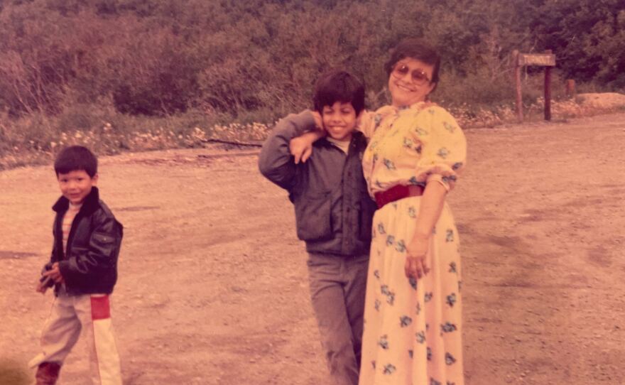 Arthur Soriano (center) with his mother in a photo from the late '80s. 