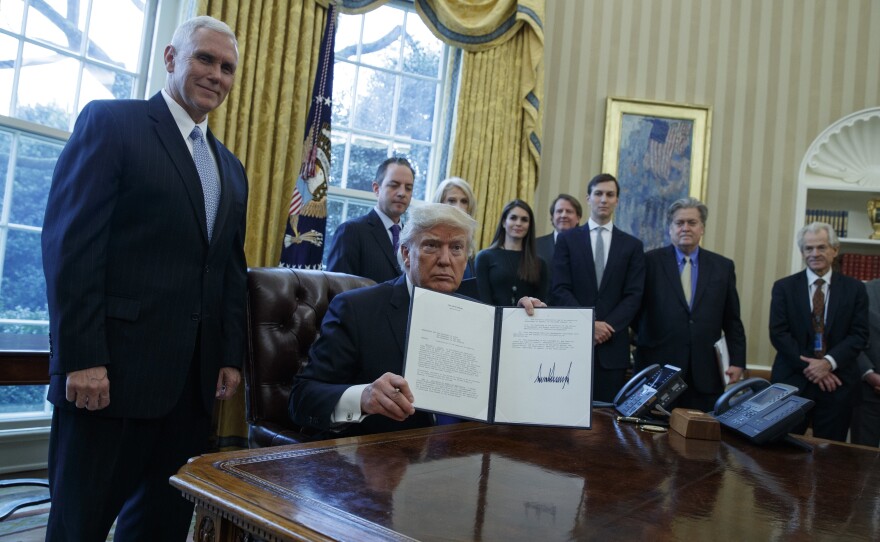 President Trump, accompanied by Vice President Pence and staff, signed multiple documents regarding two major oil pipelines in the U.S.