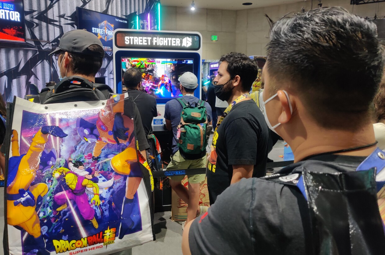 Fans wait in line to play the classic Street Fighter game at Comic-Con's Exhibit Hall, July 24, 2022.