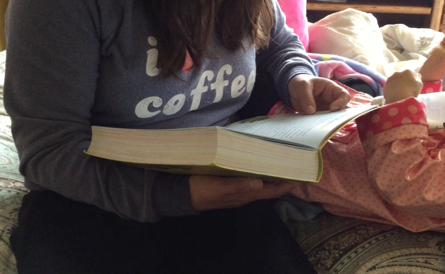 A San Diego immigrant reads to a little girl, Jan. 22, 2017. 