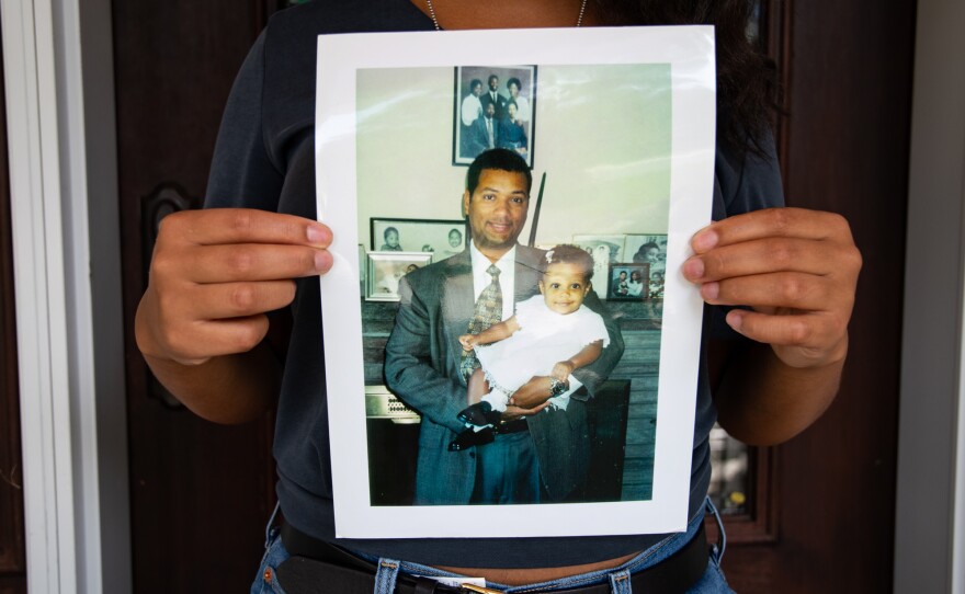 Laurel Homer shows a photo of her father holding her when she was a baby. LeRoy Homer was 36 when he died in the crash of Flight 93.