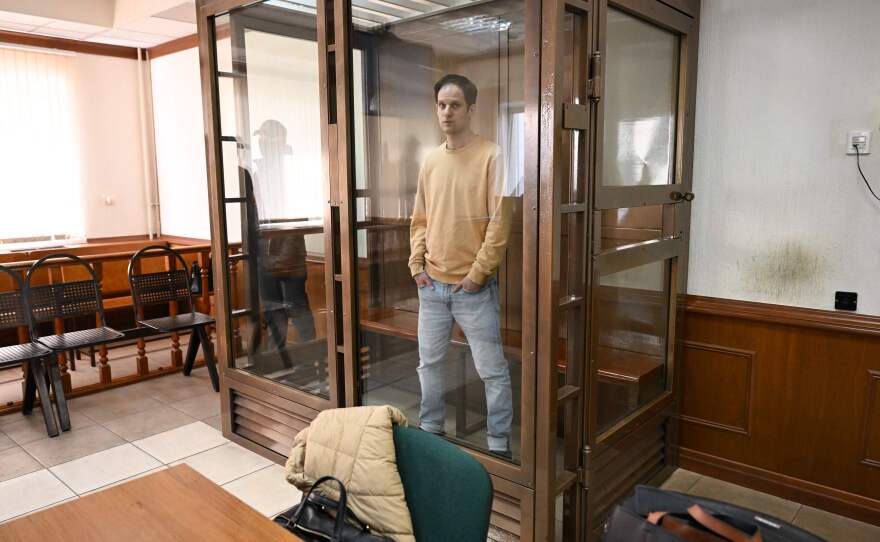 Evan Gershkovich stands inside a defendants' cage before a hearing to consider an appeal on his extended pretrial detention at the Moscow City Court on Sept. 19, 2023.