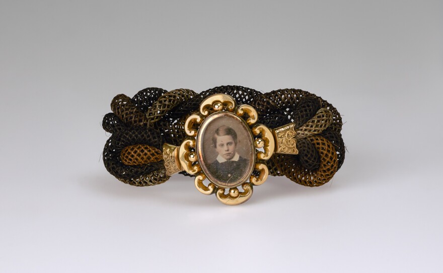 Unidentified artist, <em>Untitled (hair band, young boy)</em>, ca. 1865, daguerreotype, woven hair, metal fittings. Smithsonian American Art Museum, the L. J. West Collection of Photographic Jewelry, Museum purchase made possible through the Franz H. and Luisita L. Denghausen Endowment