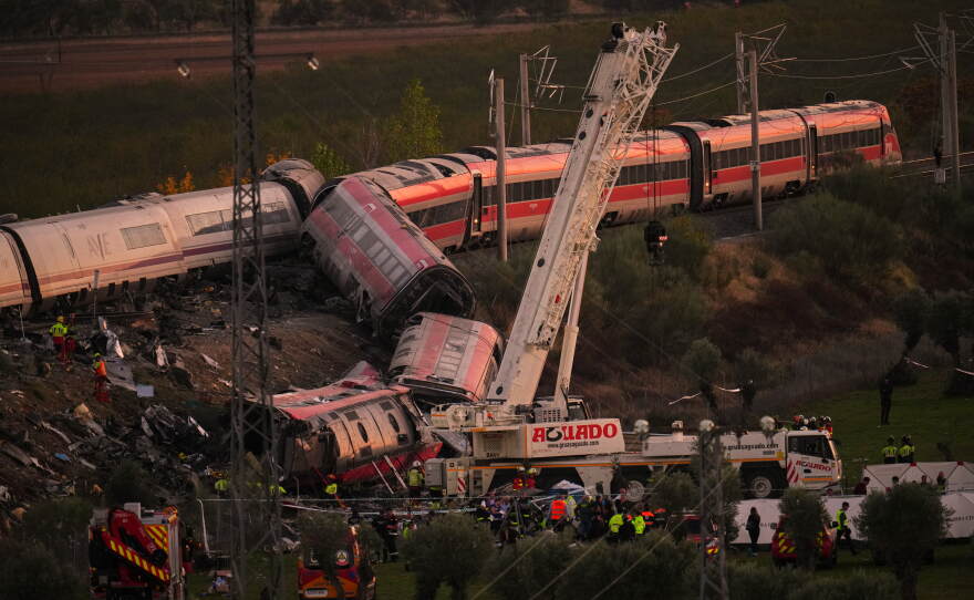 Emergency services work at the scene of a collision between two trains in Urda, Spain, on Wednesday, Oct. 28, 2026.