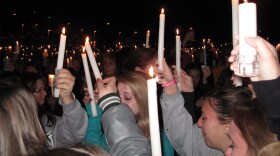 Mourners hold up candles in memory of 17-year-old Chelsea King during a vigil at St. Michael's Catholic Church in Poway on March 2, 2010.