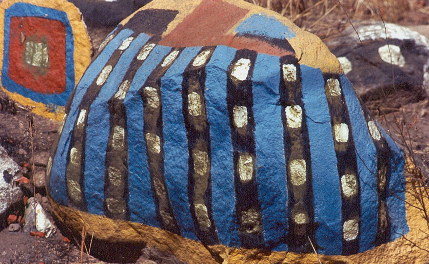 The artist brought vivid colors to the dun-colored landscape.