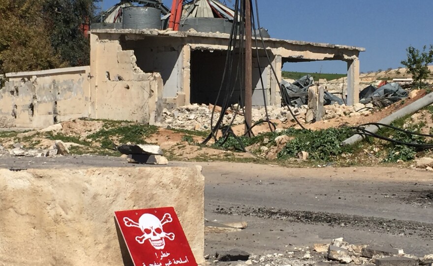 A poison hazard danger sign is seen in the town of Khan Shaykun, Idlib province, Syria. At least 70 civilians, including 20 children, were killed in a suspected chemical attack in the town.