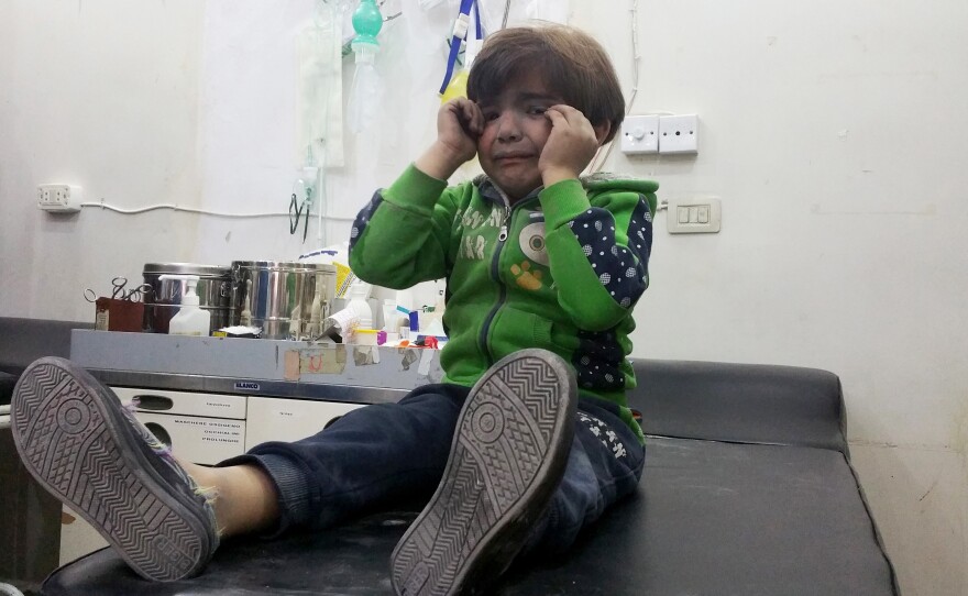 A child receives treatment at a hospital after Tuesday's attack on the town of Khan Shaykhun in Syria's Idlib province.