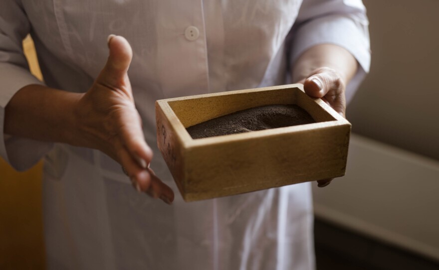 One of many soil samples from the northern Ukraine area. The smell of fuel wafts out of the box.