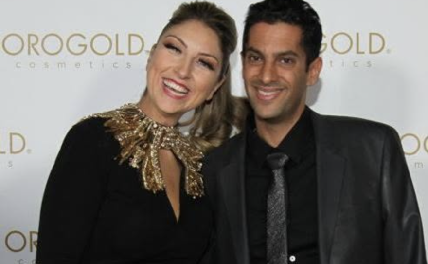 Adi Sharvit Oded and Avihu Oded pose for a picture at an Orogold Cosmetics event in 2014. The couple is now divorced, but public records show they continue to hold business licenses alongside Avihu Oded's family members, Daphna Oded Weingarten and Eli Weingarten.