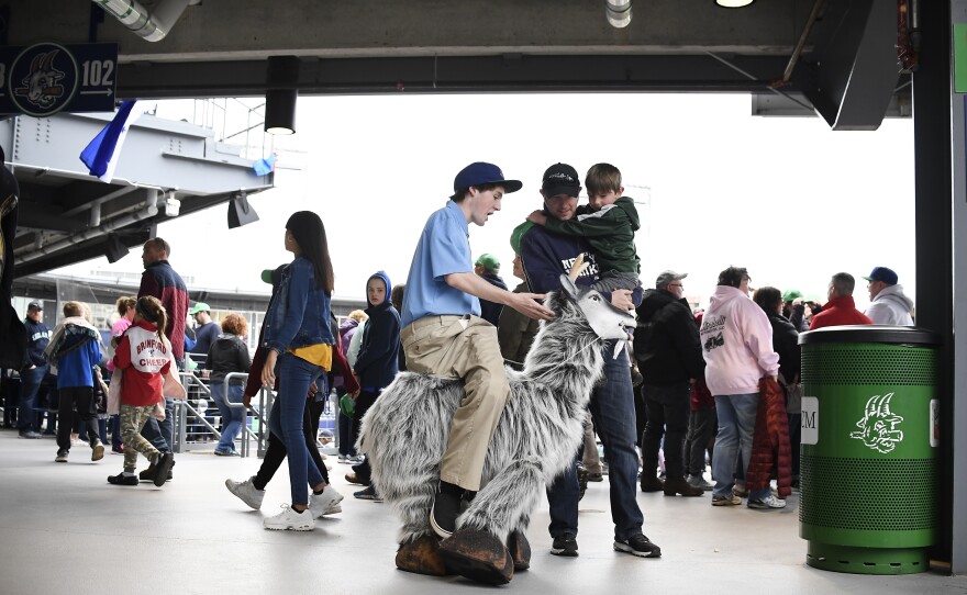 Hartford Yard Goats employee Ned Coursey stands inside a puppet goat, playing the role of the mascot Goofy Goat Herder, before a game between the Yard Goats and Richmond Flying Squirrels at Dunkin' Donuts Park in Hartford, Conn., on Tuesday, April 16, 2019.