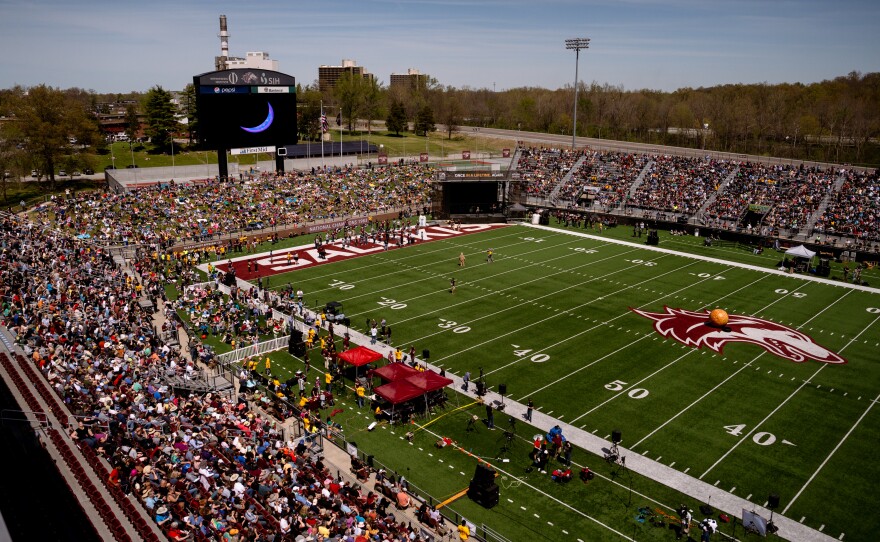 Thousands pack into Saluki Stadium to watch the total solar eclipse in Carbondale, Ill.