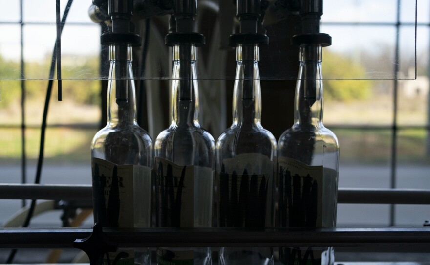 Bottles sit on bottling line at the James E. Pepper Distillery.
