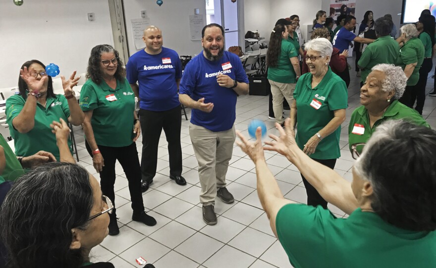 Volunteers at a retirement center in Rio Piedras take part in training to help them recognize and cope with stress and depression that's still a problem two years after Hurricane Maria.
