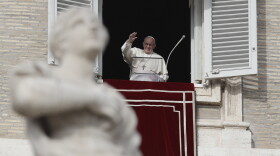Pope Francis waves to faithful during the Angelus noon prayer in St. Peter's Square, at the Vatican, Sunday, Dec. 16, 2018.