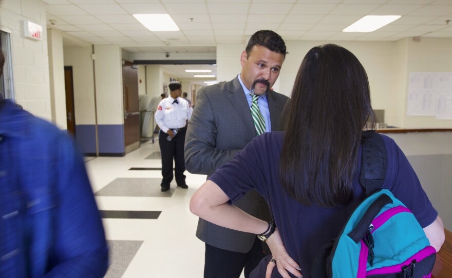 Rayamaji chats with a student after an argument between classes.