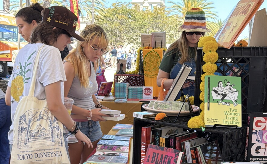Attendees browse books at the 2026 KPBS San Diego Book Festival at the University of San Diego on Aug. 22, 2026.