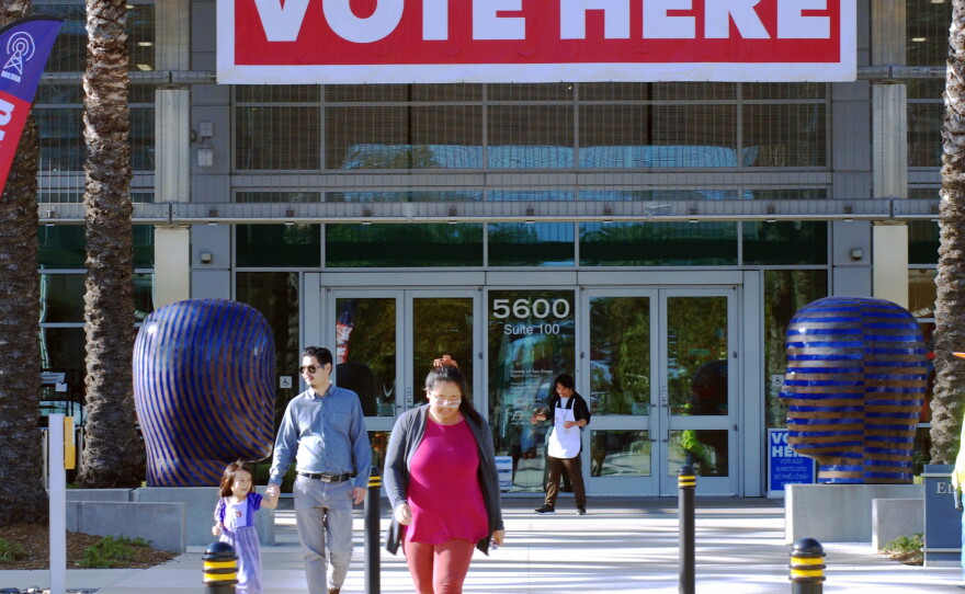 Voters walk in front of the Registrar of Voters on Election Day on June 2, 2026.