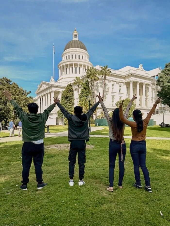 “A.L.,” (far left) an unaccompanied minor from Honduras visits the state Capitol in March of 2024 to advocate for funding for the CHIRP program, which helps protect migrant children alone in the U.S. from deportation.