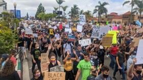 Protesters march in Hillcrest on the ninth-straight day of protests against racial injustice and police brutality throughout San Diego.