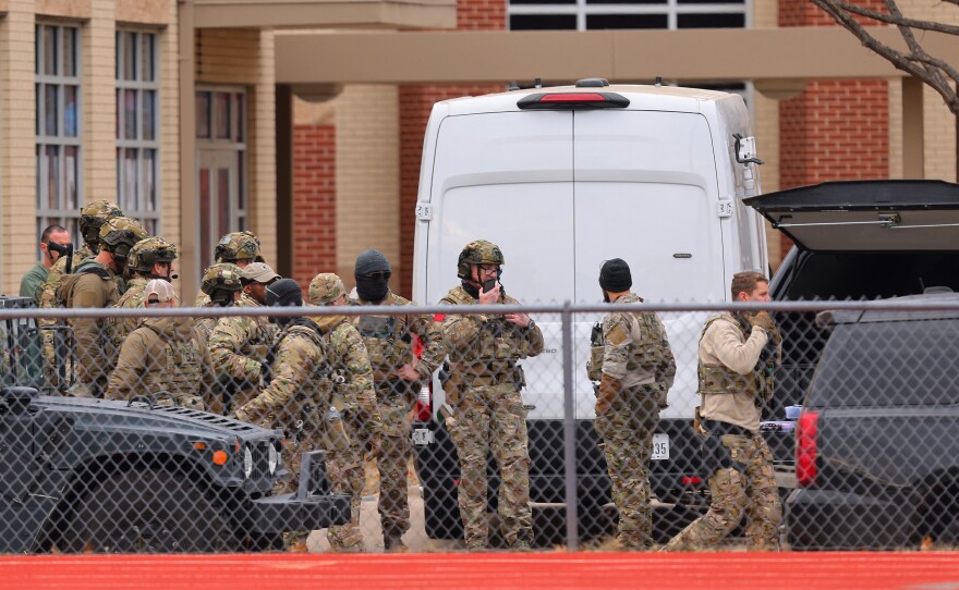 SWAT team members deploy near the Congregation Beth Israel Synagogue in Colleyville, Texas, near Dallas, on Saturday.