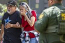 A woman cries as she leaves the Uvalde Civic Center, Tuesday May 24, 2022, in Uvalde, Texas.