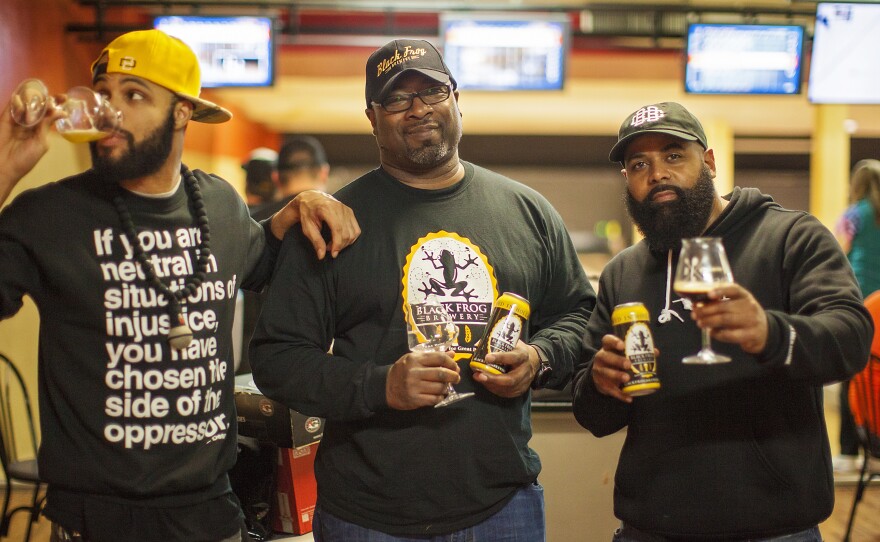 Fresh Fest co-founders Day Bracey (left) and Mike Potter (right) visit with Chris Harris, owner of Black Frog Brewery in Holland, Ohio, near Toledo.