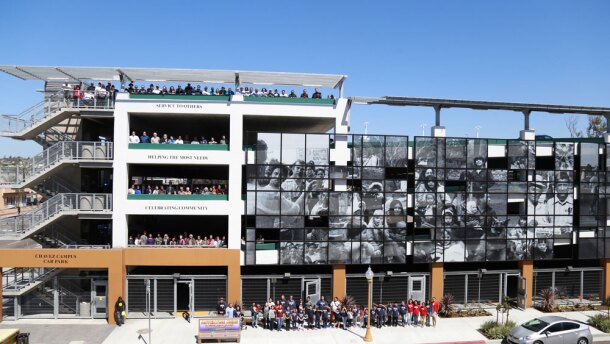 People who attended the dedication posed for a five-story group photo at San Diego Continuing Education's new Cesar Chavez car park in Barrio Logan. 