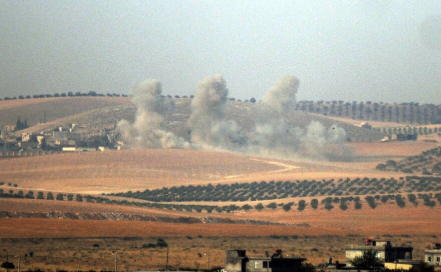 Smoke billows in the Syrian border area, photographed Wednesday from across the border in Karkamis, Turkey.