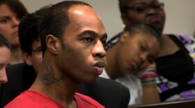 Kenneth Young at his resentencing hearing, with his mother and niece in the background.