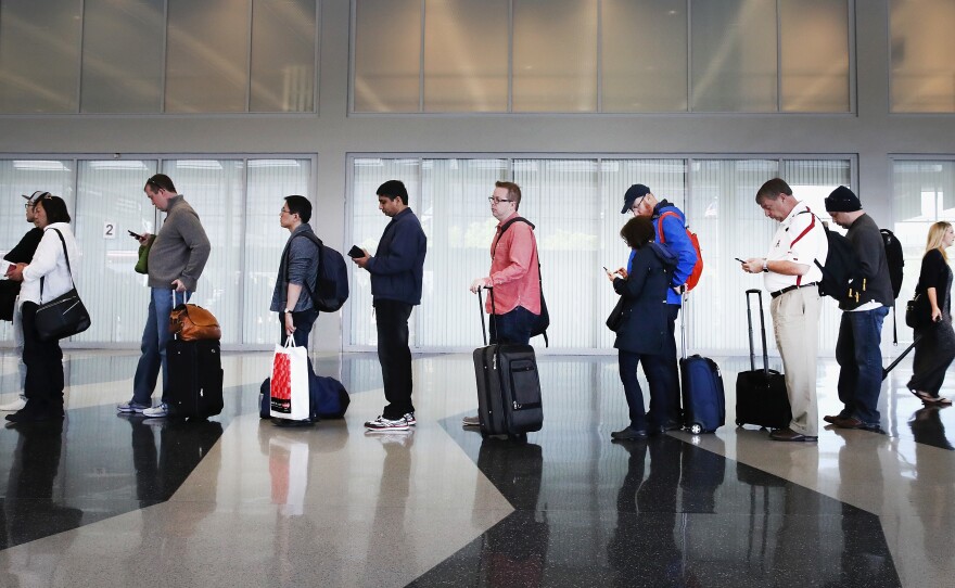 Passengers at Chicago's O'Hare International Airport wait in line for security screening in May 2016. A study released Monday found that U.S. airline quality is higher than ever, but air travelers may disagree.