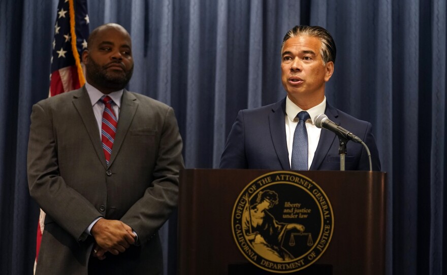 California Attorney General Rob Bonta, right, fields questions during a press conference Monday, Aug. 28, 2023, in Los Angeles. 