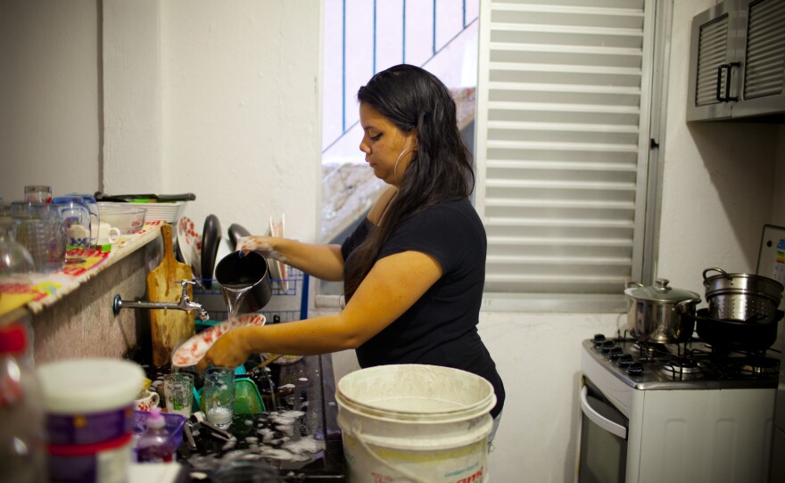 Renata Trindade, 26, lives in a northern neighborhood of Sao Paolo with her boyfriend. She says the government has been rationing water, so she sets aside dirty dishes to conserve water for bathing and flushing toilets. On weekdays, she gets water from 4 a.m. to 1 p.m. and on weekends, from 7 a.m. to 2 p.m.