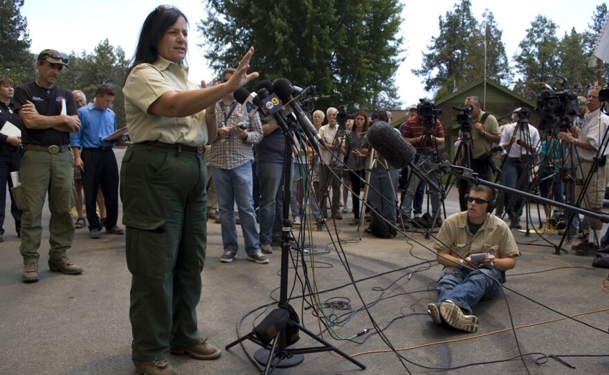 Jeanne Pincha-Tulley, a Type 1 incident commander, addresses the media in the then-evacuated town of Idyllwild, as the Mountain Fire grows closer. Pincha-Tulley has a reputation for being frank and direct with the media and public. "For the next two days," she said, "the fire is going to put embers right over this town."