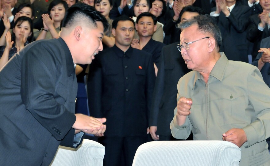The late North Korean leader Kim Jong Il, right, exchanges words with his son and successor, Kim Jong Un, in July 2011. The elder Kim died in December 2011.