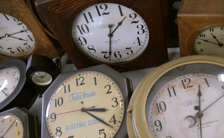 In this March 5 photo, antique clocks are displayed at the Electric Time Company in Medfield, Mass. Daylight saving time returns Sunday at 2 a.m. local time.