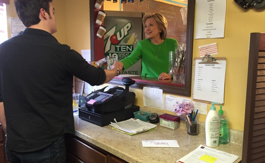 Hillary Clinton meets her barrista. She ordered a chai tea, a caramel latte and a water.