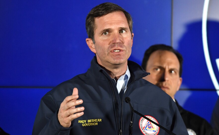 Kentucky Gov. Andy Beshear speaks to reporters during a news conference in Louisville, Ky., on Monday.