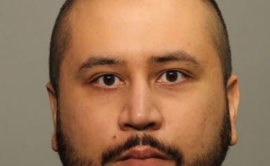 In this photo provided by Seminole County Sheriff`s Office, George Zimmerman poses for a mug shot after being arrested and booked into jail at the John Polk Correctional Facility Jan. 9, 2015, in Sanford, Fla. Florida officials reported that Zimmerman had been charged with aggravated assault and domestic violence with a weapon.