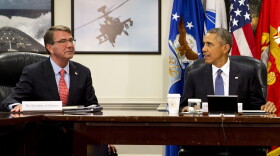 Defense Secretary Ash Carter, left, and President Barack Obama, talk to each other before an update on the Islamic State group at the Pentagon, July 6, 2015.