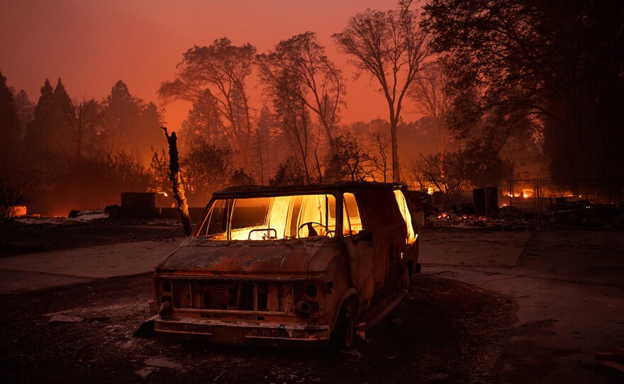 Flames burn inside a van as the Camp Fire tears through Paradise, Calif., on Thursday, Nov. 8, 2018.