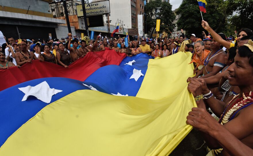 Indigenous people prepare to take part in the opposition march in Caracas.